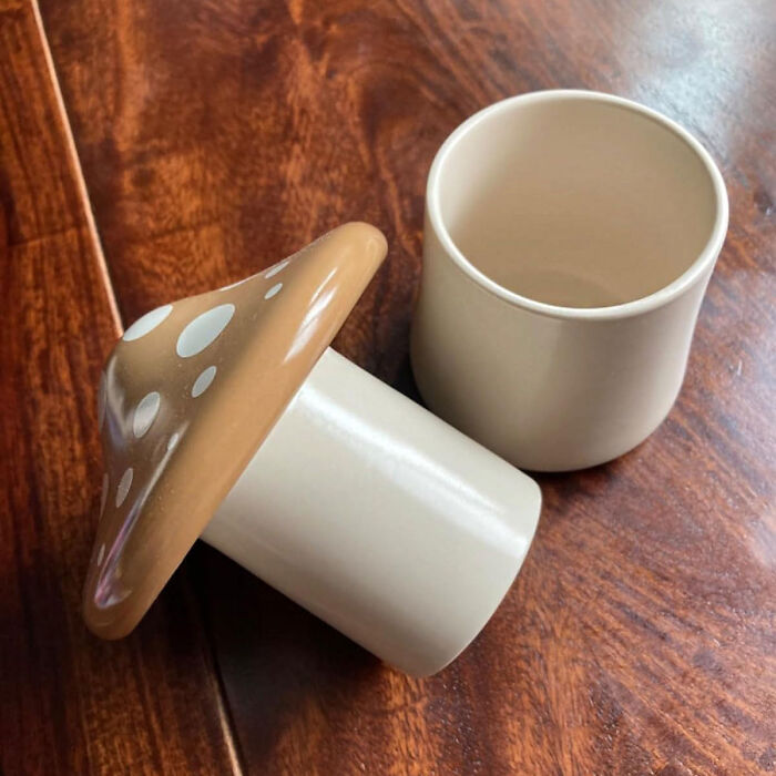Mushroom-shaped kitchen item on a wooden table, showcasing unique and functional design.