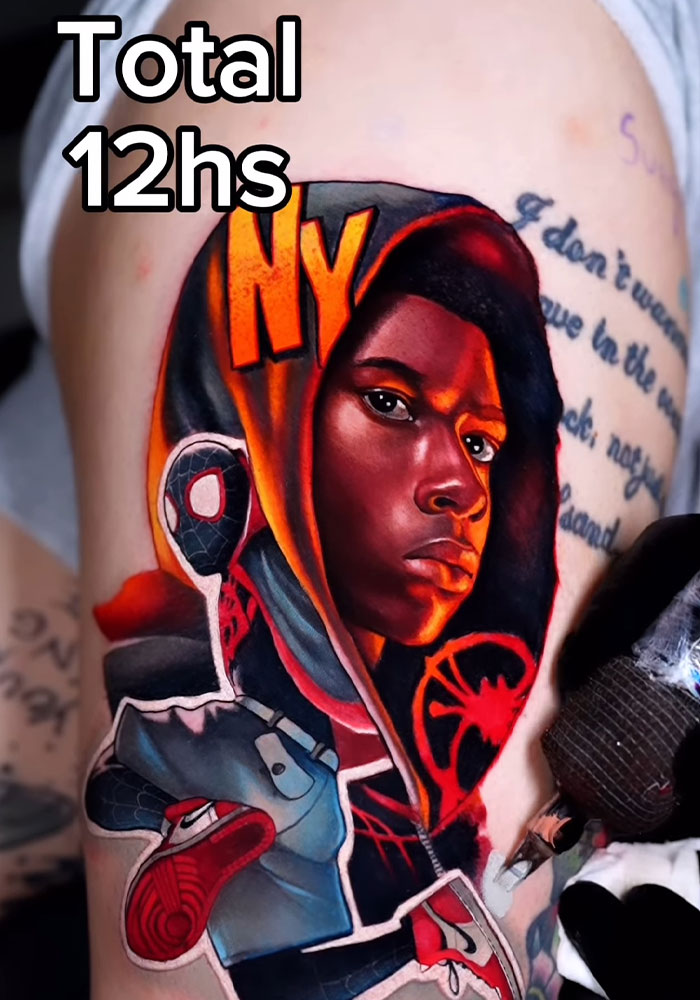 Vibrant Mario-themed tattoo featuring a character in a hoodie on a person's arm.