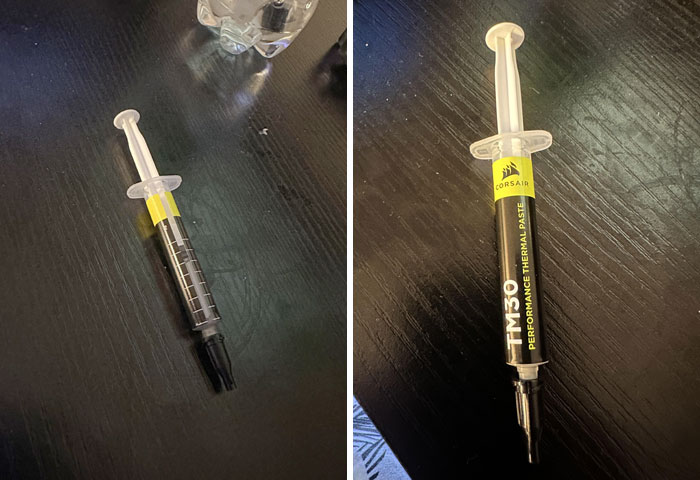 Thermal paste syringe mistakenly placed on a table, showing clueless people surprised with their stupidity moments.