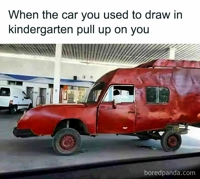 Oddly shaped red car resembling a child's drawn vehicle, capturing '80s meme humor.