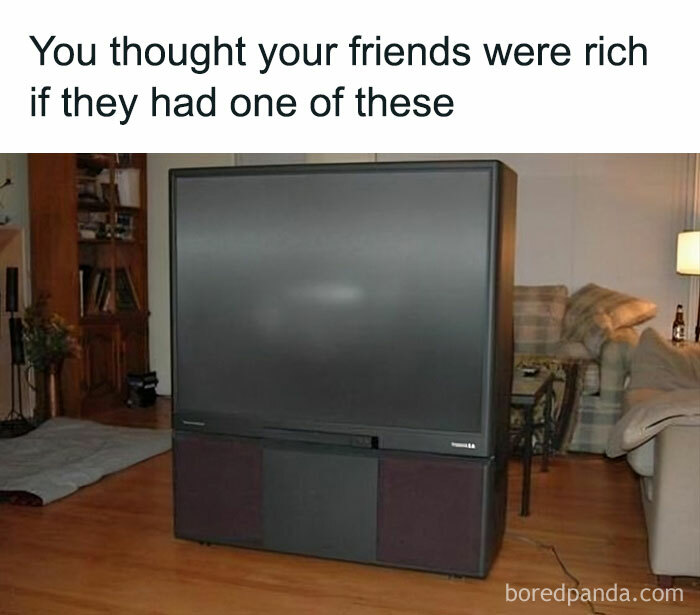 A large retro 1980s projection TV in a living room, highlighting humorous nostalgia for Gen Xers and Millennials.