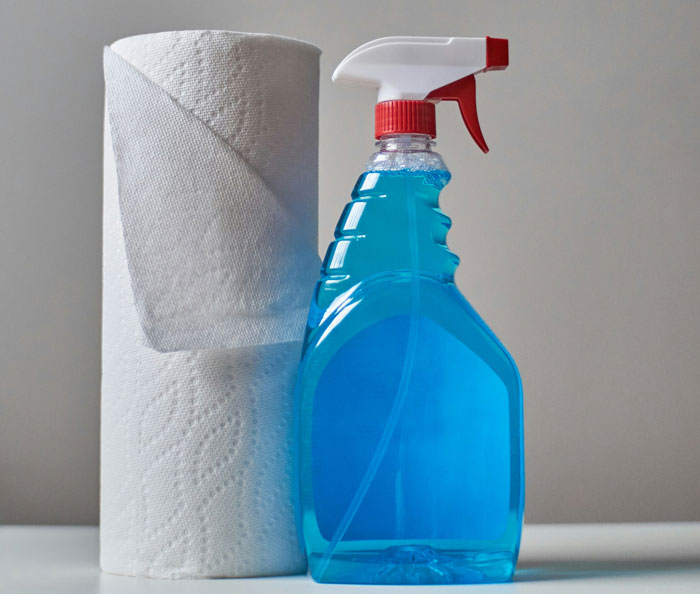 close up view of a paper towels and spray