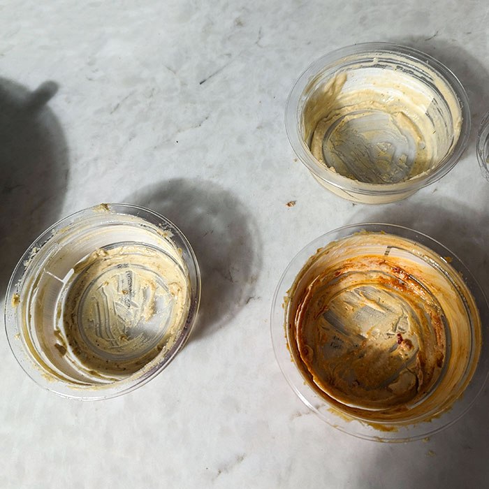 The Hummus Containers My Boyfriend Put Back In The Fridge, Leaving A Little Bit For Later, I Guess