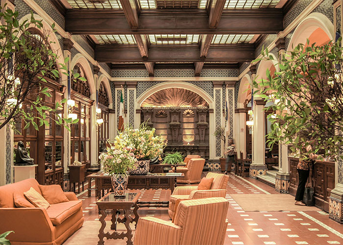 Luxurious interior with elegant furniture and decorative plants, showcasing the shock of how others live.