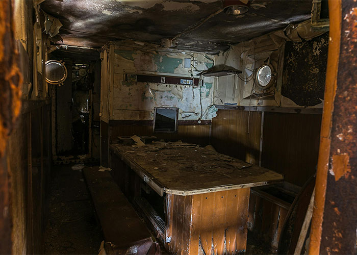 Dilapidated interior of a neglected living space showing shocking conditions people live in, revealing harsh reality and decay.