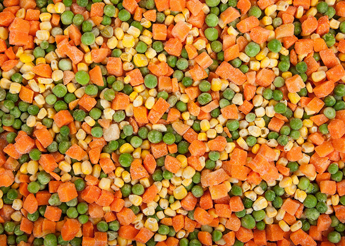 Close-up of frozen mixed vegetables including carrots, peas, and corn, illustrating crunchy food texture and opinions.