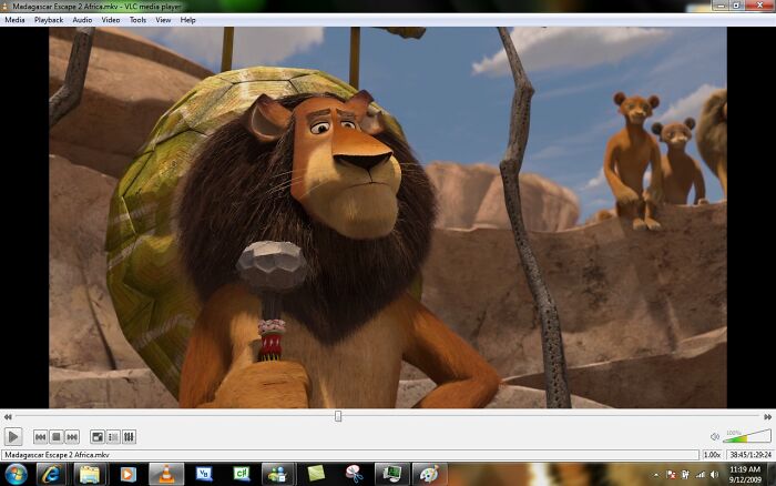 Animated lion character holding a scepter, highlighting a scene from free software media.