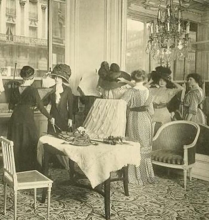 A Group Of Ladies Buying Hats In A Paris Salon, 1910