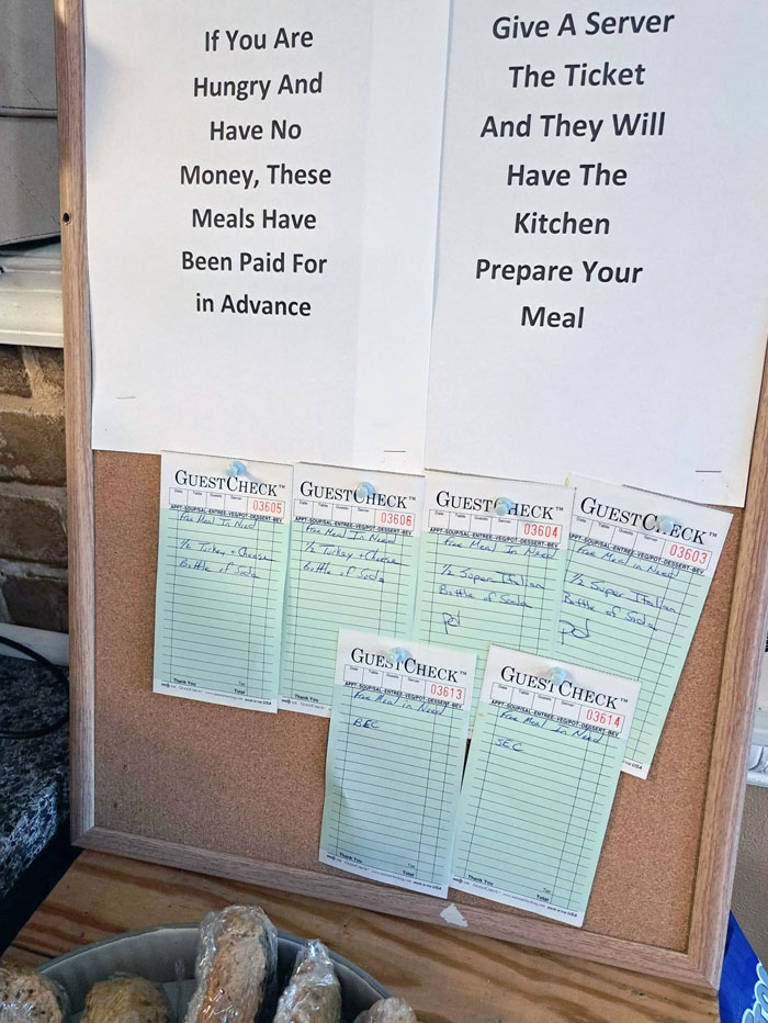 Board at a bar restaurant showing prepaid meals for those hungry with no money, showcasing brilliant ideas in hospitality.