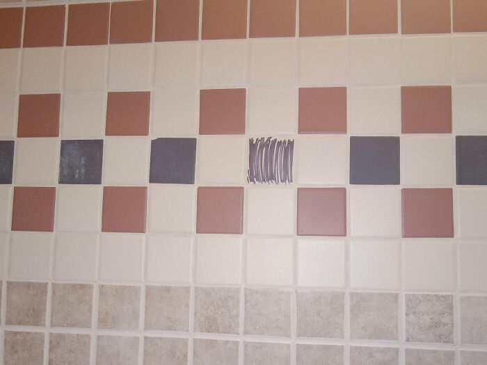 Tile pattern fail with mismatched scribbles in place of one tile.
