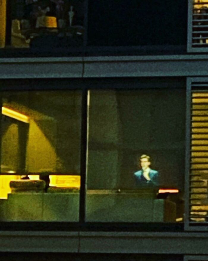 Photo From John Mulaney's Twitter Of A Neighboring Apartment Playing His Special, Comeback Kid, That Resembles An Edward Hopper Painting