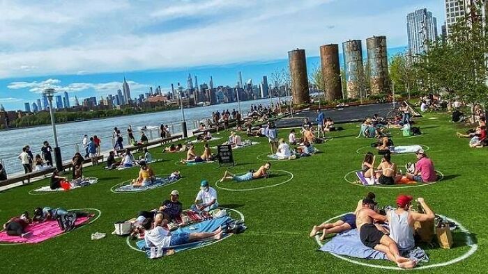 White Circles Were Painted On The Lawn In Brooklyn's Domino Park To Help Sunbathers And Picnickers Keep A Safe Distance