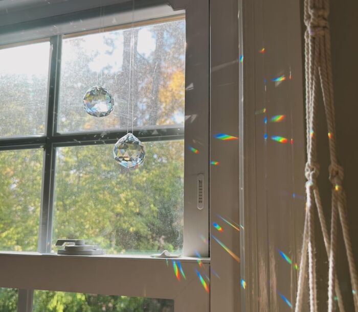 "Sunlight through window prisms creating colorful reflections; a cheerful Mother’s Day gift idea."