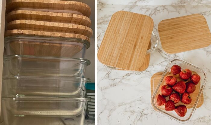 Glass containers with bamboo lids for organizing your fridge and pantry, with one holding fresh strawberries.