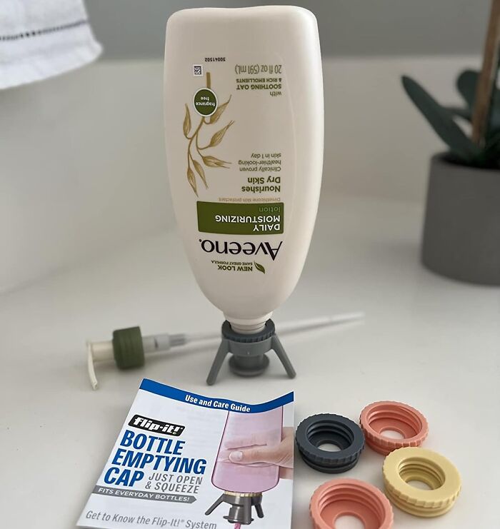 Flip-it bottle emptying cap with daily moisturizing lotion and colorful replacement caps on a white surface.
