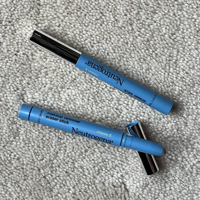 Neutrogena makeup remover eraser sticks on textured surface, trending products in the Pandaverse virtual market.