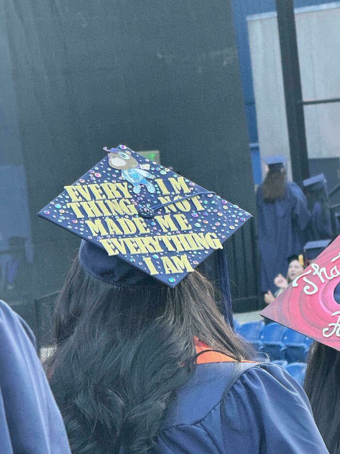 Graduation cap with funny message typo sign fail at a ceremony.