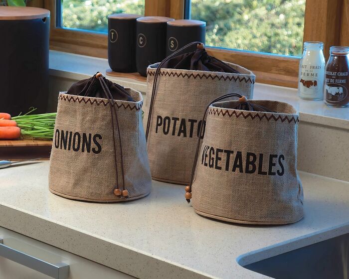 Reusable storage bags for onions, potatoes, and vegetables on a kitchen counter, everyday finds to fix your annoyances.
