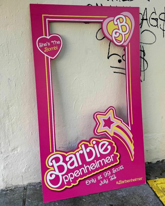 Pink cardboard frame with "Barbie Oppenheimer" design, left as treasure on NYC curb.