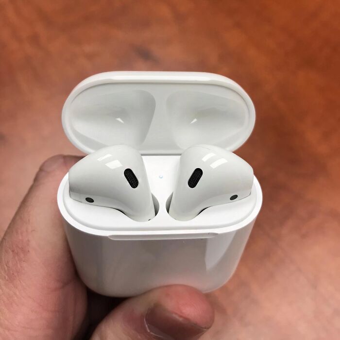White wireless earbuds in a charging case, a popular Amazon bestseller.