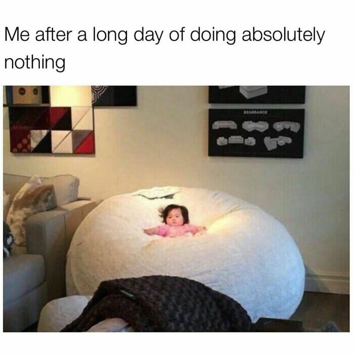 Baby nestled in a giant bean bag, representing relatable memes humor.