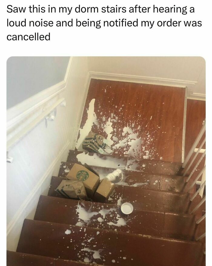 Spilled coffee and broken Starbucks boxes on dorm stairs showing student life ups and downs in young adults' daily struggles.
