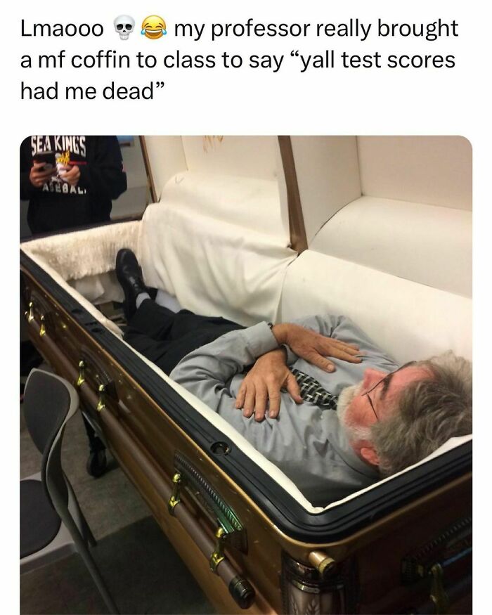 Professor lying in a coffin in class as a joke about students and young adults living the best and worst life at the same time.