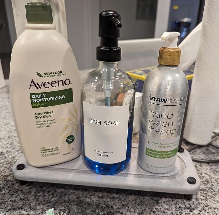 Bathroom products on a tray including lotion, dish soap, and hand wash therapy with 5-star reviews.