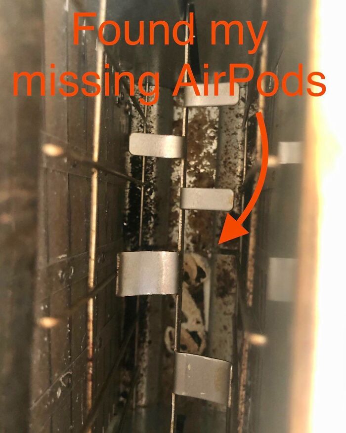 AirPods stuck inside a narrow appliance vent showcasing a common mishap for parents having a pretty miserable day.