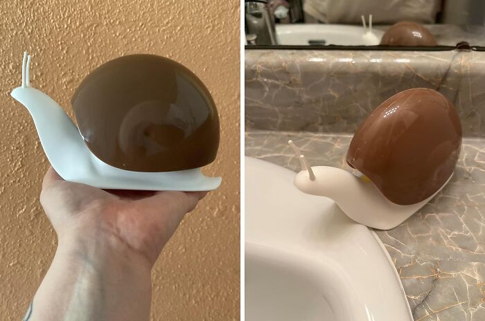 Novel snail-shaped soap dispenser, a unique bathroom product, displayed beside a sink.