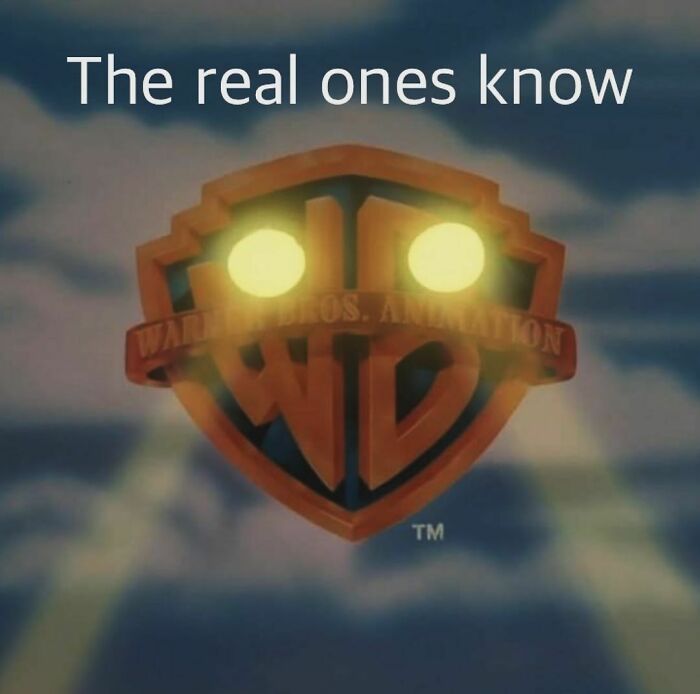 Warner Bros Animation logo with glowing eyes and nostalgic text The real ones know, evoking childhood memories and nostalgia.