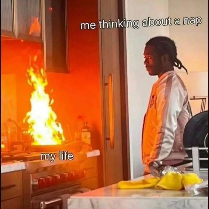 Person staring at a kitchen fire with humorous captions about life and naps, relating to barely functioning memes.