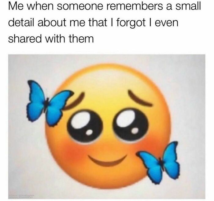 Shy emoji surrounded by blue butterflies, capturing relatable meme vibes.