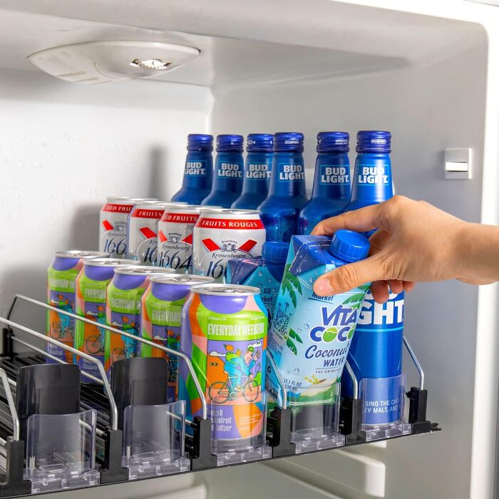 Organized fridge shelf with drinks, showcasing simple products to reinvent your pantry and fridge.