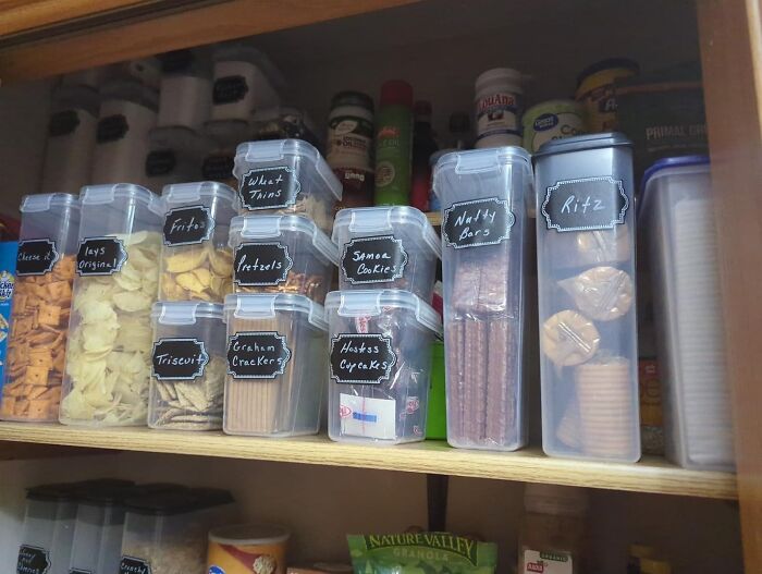 Organized pantry with labeled containers, showcasing simple products to reinvent storage and organization.