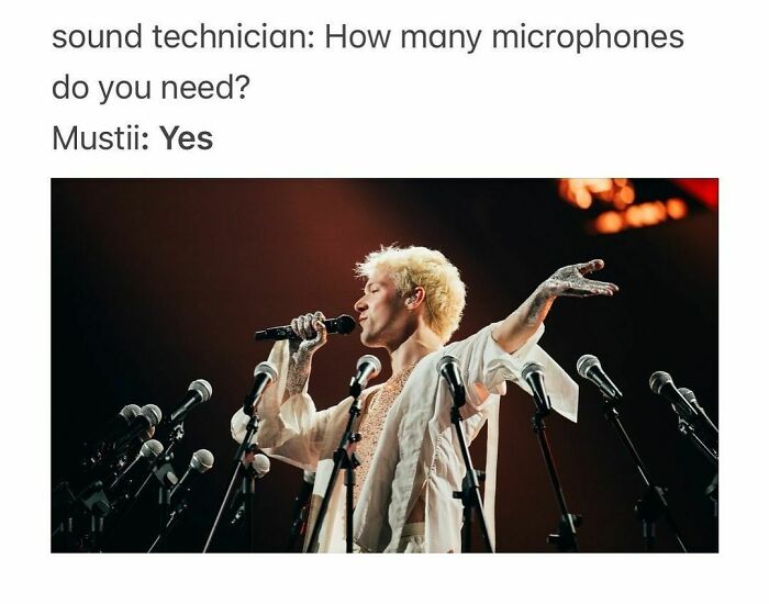 Performer surrounded by multiple microphones, capturing the humor of Eurovision Song Contest 2024.