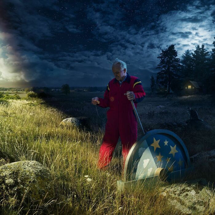 Man in red overalls manipulating landscape at night in surreal photo by Swedish Photoshop master Erik Johansson.