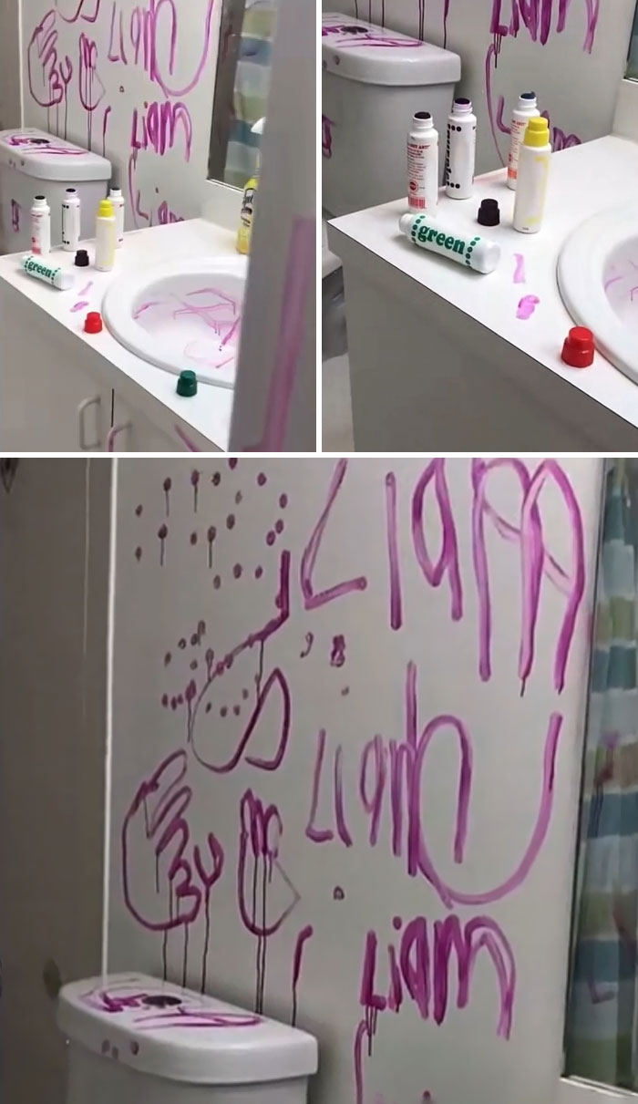Bathroom walls and mirror covered in purple marker scribbles with various toiletries on the sink, showing parents having a messy day.