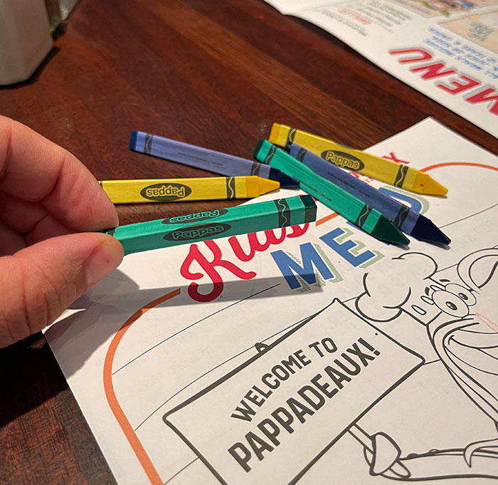 Crayons on a colorful activity placemat at a bar and restaurant, showcasing creative ideas for guest engagement.