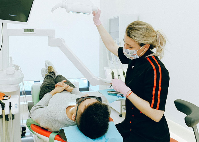 Dentist examining patient, capturing a cringe-worthy experience.