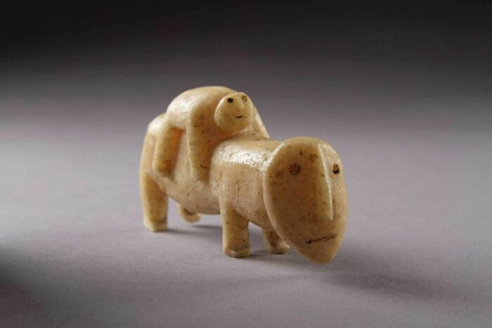 Anthropomorphic Figure Of A Polar Bear With Its Cub. Medium: Carved Walrus Ivory. Culture: Native Alaskan. Date: C. 1800 To 1900. Place Of Origin: Bering Sea
