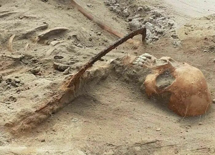 Archaeologists Discovered A 17th Century Ce, Female "Vampire" With A Sickle Across Her Throat, Meant To Prevent A Return From Dead, Found In Pieñ, Poland