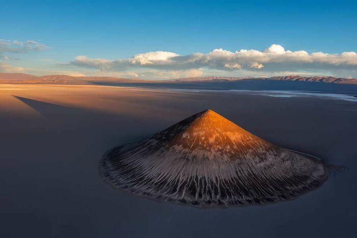 Volcanic mountain glowing at sunset in a breathtaking landscape photo featured in 2024 ReFocus Awards collection