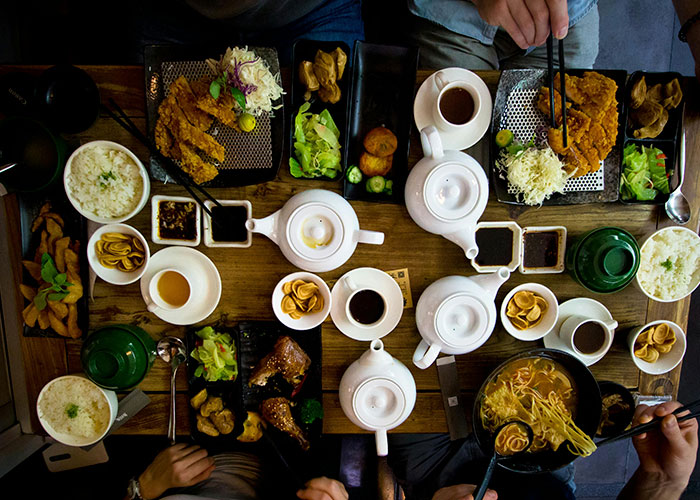 Overhead view of a meal with diverse dishes, illustrating improbable but unforgettable food experiences people encountered.