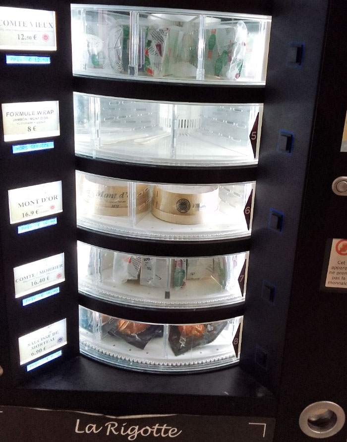 A Dispenser That Sells Local Cheese (Fromage) And Morteau's Sausages In The Train Station (Besancon, France)