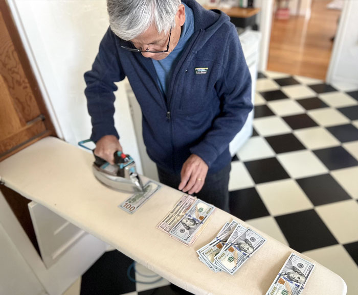 My Dad Ironing American Cash Before A Trip To The Old Country