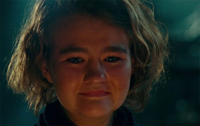 Young person with short hair and a tear, reflecting on moments from today I learned discoveries.