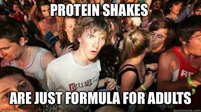 Young man at a crowded party realizing protein shakes are like formula for adults, capturing funny and goofy dad moments.