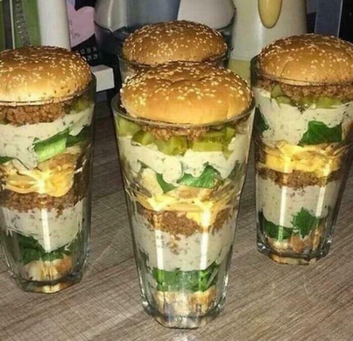 Layered burgers in glasses with toppings, one of 65 unbelievable dishes.