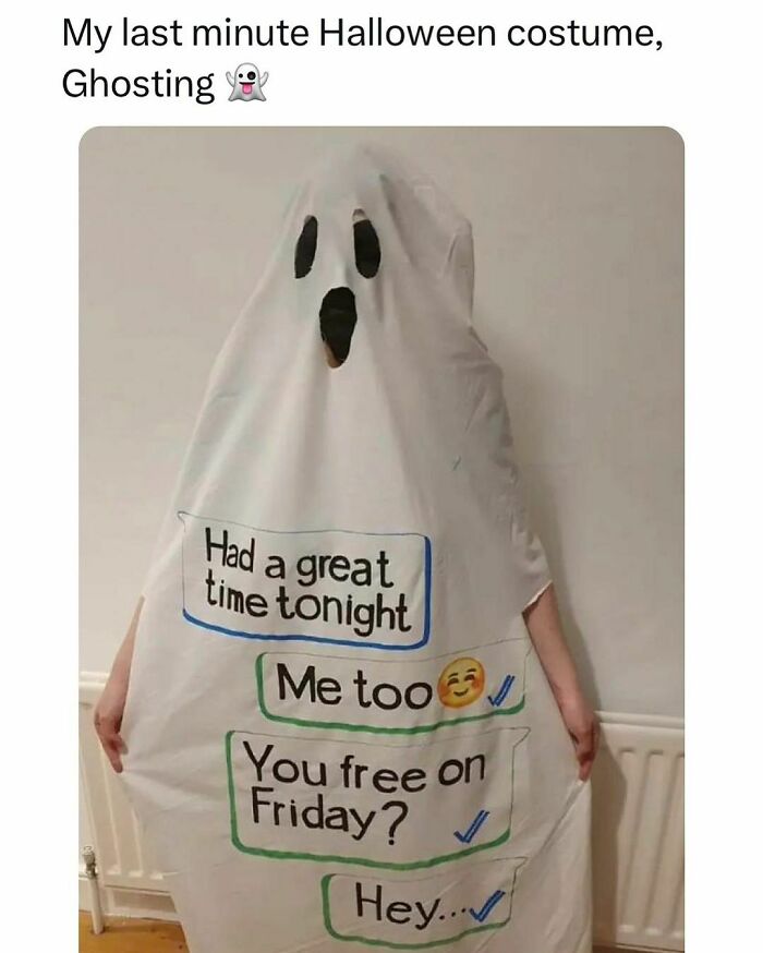 Person dressed as a ghost wearing a costume with relatable text messages about socializing, reflecting student and young adult life.